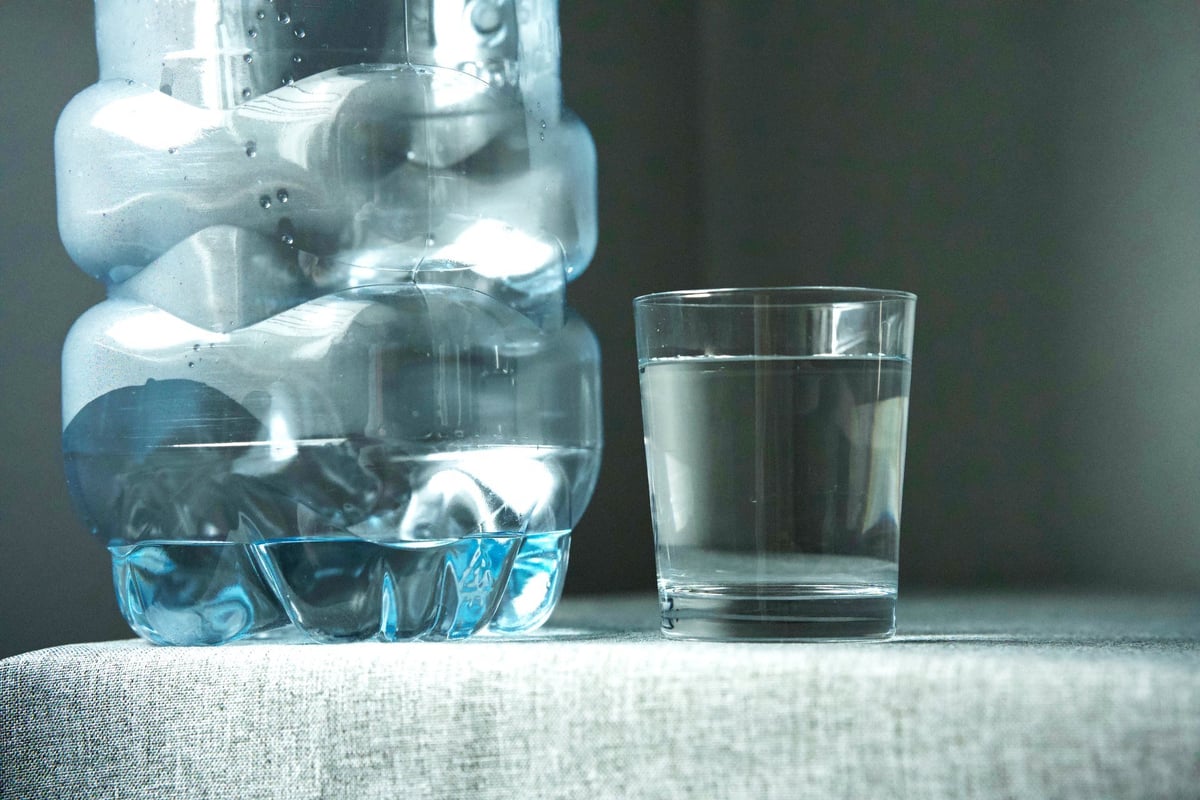 Crystal clear water in a glass, representing purity and laboratory testing standards