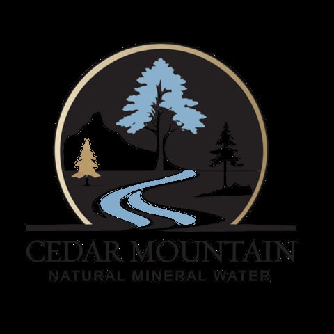 Cedar Mountain Natural Mineral Water logo featuring a circular emblem with stylized trees, mountains, and a winding blue stream