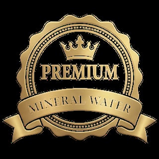 Gold premium mineral water badge with crown and decorative scalloped border on black background