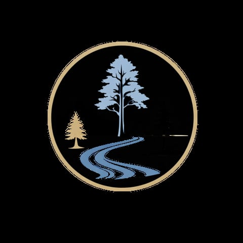 Circular emblem with gold border featuring a forest scene with trees, mountains, and winding river on black background